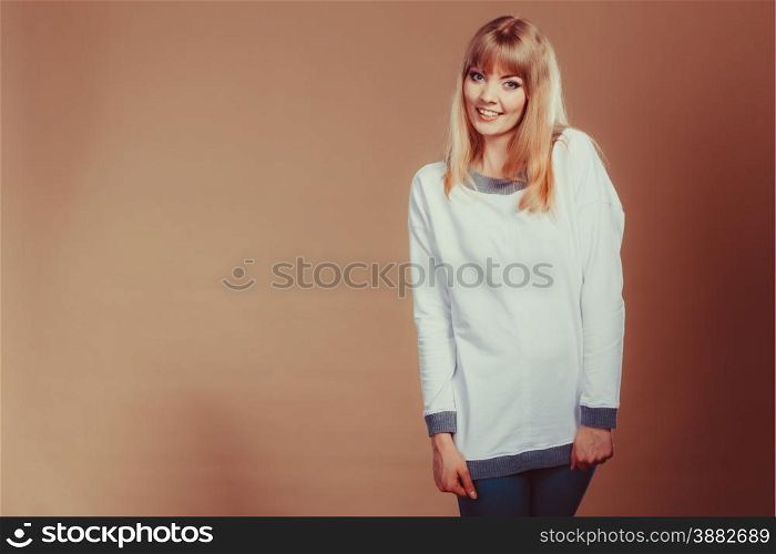 Fashion. Young fashionable woman casual style looking and smiling. Filtered photo