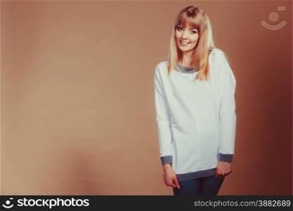 Fashion. Young fashionable woman casual style looking and smiling. Filtered photo