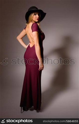 fashion young woman full length on a grey background