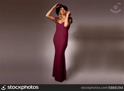 fashion young woman full length on a grey background