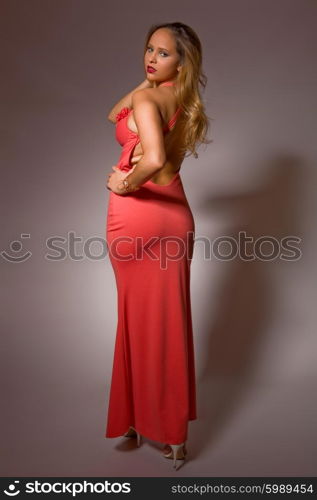 fashion young woman full length on a grey background