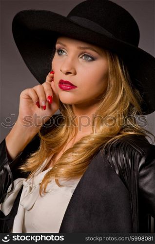 fashion young woman on a dark background