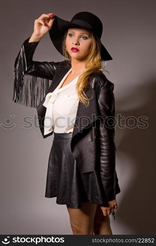 fashion young woman on a grey background