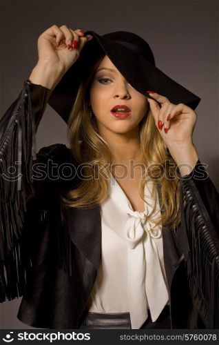 fashion young woman on a grey background