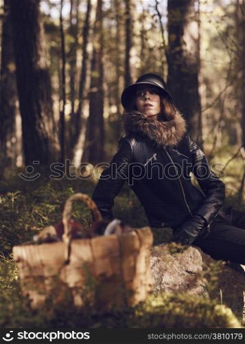 Fashionable beautiful woman and mushroom basket - warm tinted image