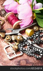 Fashionable female bijouterie. Stylish female retro jewelry made of chains, beads and pendants.Design and bijouterie