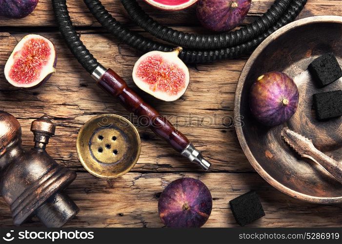 fashionable hookah in figs. Tobacco background.Turkish smoking hookah with tobacco flavor of ripe figs