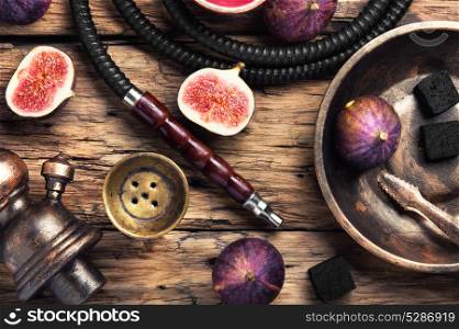 fashionable hookah in figs. Tobacco background.Turkish smoking hookah with tobacco flavor of ripe figs