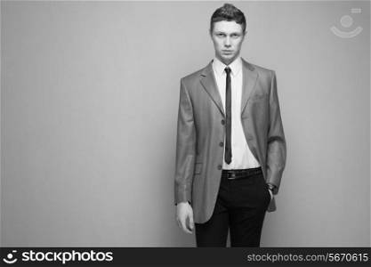 Fashionable man in grey suit
