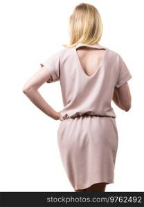 Fashionable pretty woman wearing elegant casual pink tunic dress presenting stylish elegant outfit. Back view with triangle shaped hole.. Female wearing casual pink tunic dress