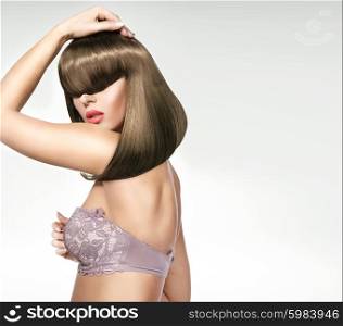 Fashionable shot of the female model with a trendy coiffure