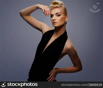 Fashionable woman in black with creative hairstyle