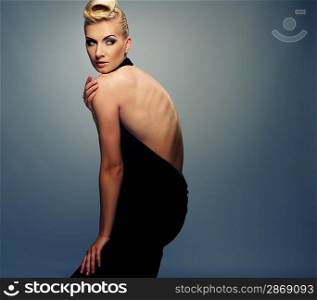 Fashionable woman in black with creative hairstyle
