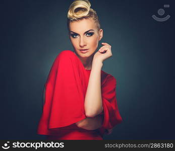 Fashionable woman in red with creative hairstyle