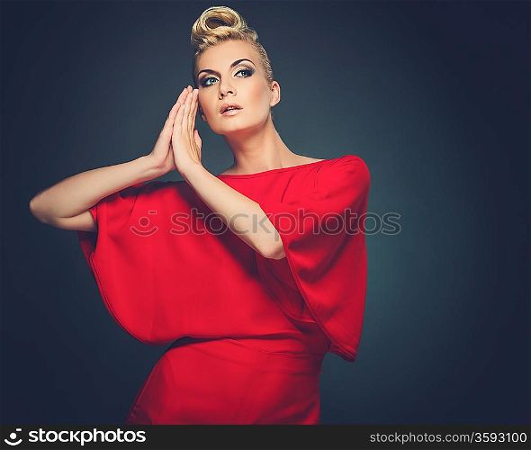 Fashionable woman in red with creative hairstyle