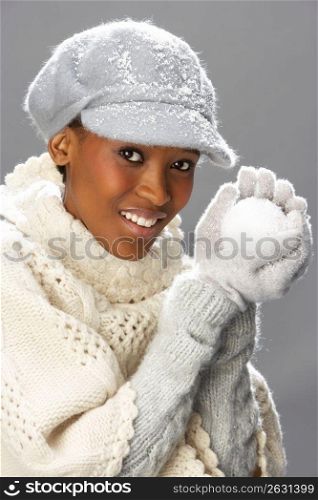 Fashionable Woman Wearing Knitwear And Cap In Studio