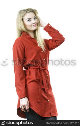 Fashionable woman wearing long red vintage dress and black leggings. Autumnal outfit concept.. Woman presenting autumn outfit