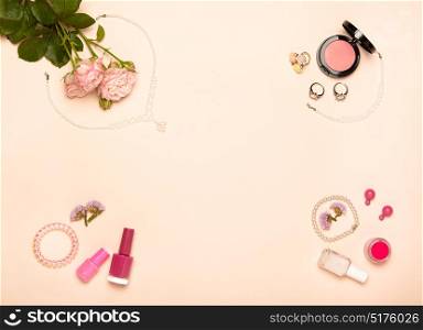 Fashionable Women&rsquo;s Cosmetics and Accessories. Falt Lay. Nail Polish and blush. Jewelry and Rings. A bouquet of flowers. Pink roses