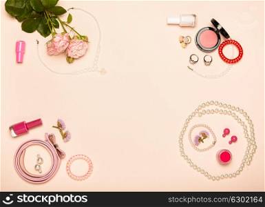 Fashionable Women&rsquo;s Cosmetics and Accessories. Falt Lay. Nail Polish and blush. Jewelry and Rings. A bouquet of flowers. Pink roses