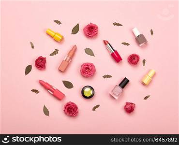 Fashionable Women&rsquo;s Cosmetics and Accessories. Falt Lay. Nail Polish and Lipstick. Beautiful Roses Flower. Make Up Cosmetic items Top View