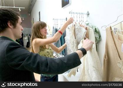 Fashionable Young Couple Shopping Together In A Boutique