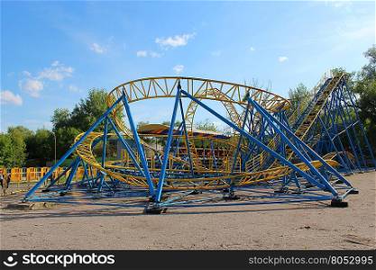 fast attraction roller-coaster. small attraction small roller-coaster in Chernihiv town