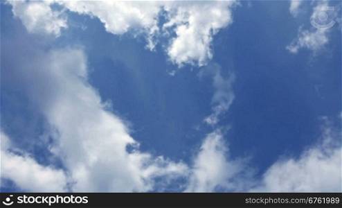 Fast cloud movement on blue sky