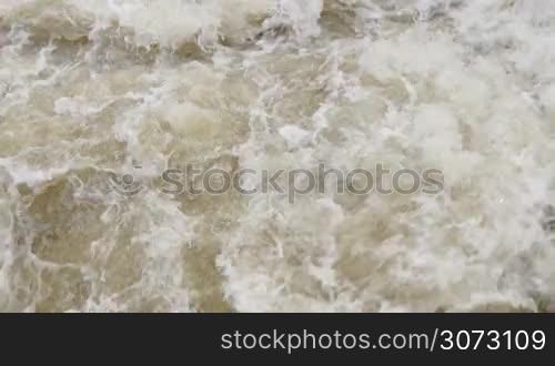 Fast flowing water on the river