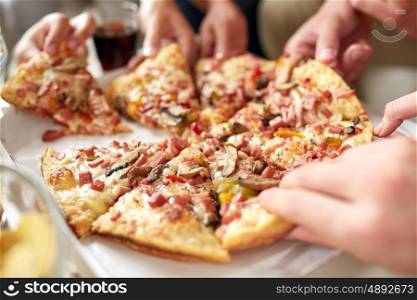 fast food, eating and people concept - close up of hands taking pizza slices