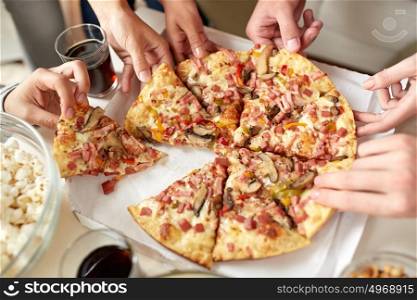 fast food, eating and people concept - close up of people taking pizza slices from box. close up of people taking pizza slices from box