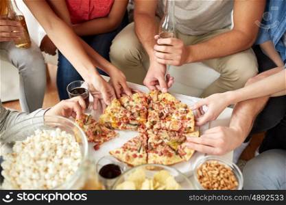 fast food, eating, party and people concept - close up of people taking pizza slices at home