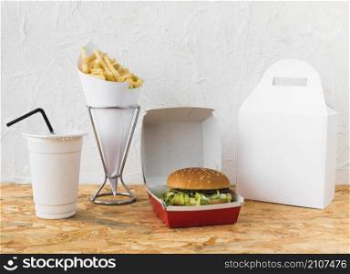 fast food with disposal cup food parcel mock up wooden desk