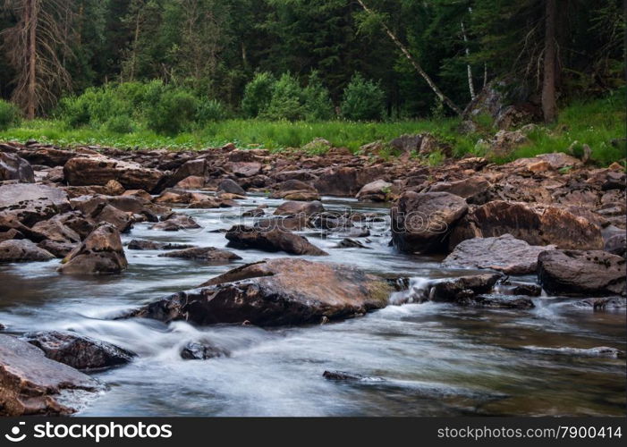 fast mountain river flowing among stones. landscape