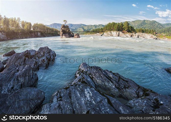Fast mountain river Katun. Fast mountain river Katun in Altay, Siberia, Russia. A popular tourist place called the Dragon&rsquo;s Teeth