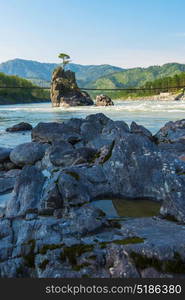 Fast mountain river Katun. Fast mountain river Katun in Altay, Siberia, Russia. A popular tourist place called the Dragon&rsquo;s Teeth