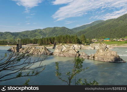 Fast mountain river Katun. Fast mountain river Katun in Altay, Siberia, Russia. A popular tourist place called the Dragon&rsquo;s Teeth