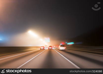 Fast night driving on highway, view from inside of a car