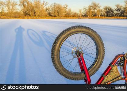 fat bike and shadows on a frozen lake in northern Colorado
