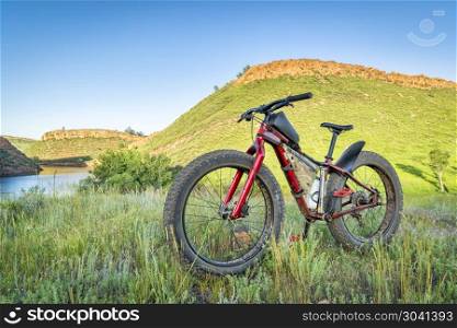 fat bike at foothills of Colorado. fat mountain bike at grassy foothills of Colorado, late spring scenery