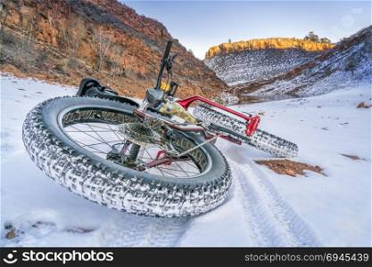 fat bike on a winter trail covered by snow at Colorado foothills