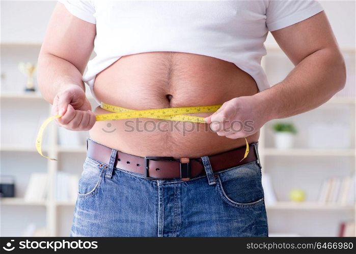 Fat obese man in dieting concept