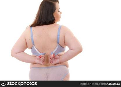 Fat woman rear view opening taking off or putting on her bra. Plus size overweight female wearing lingerie. Bosom, underwear and proper fitting bras.. Woman back view putting on her bra lingerie.