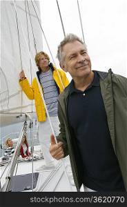 Father and adult son on yacht