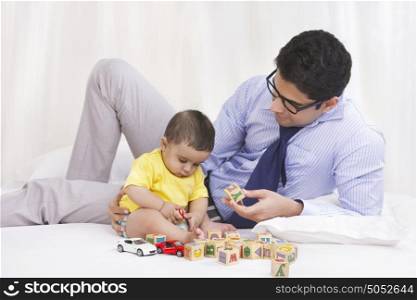 Father and baby with building blocks