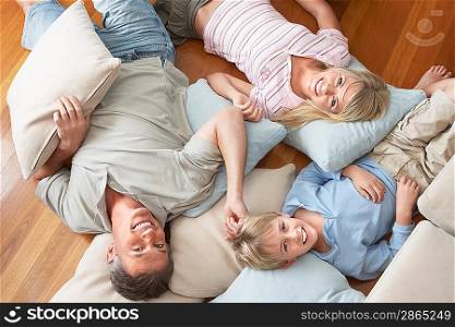 Father and Children Lying on Floor