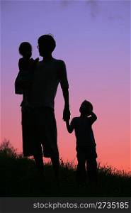father and children on sunset