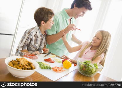 Father And Children Prepare A meal,mealtime Together