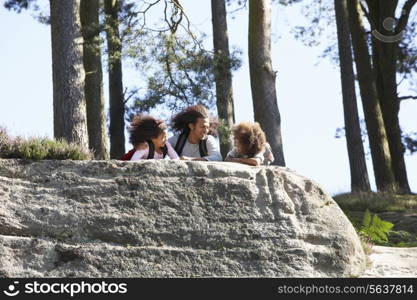 Father And Children Resting On Hike Through Countryside