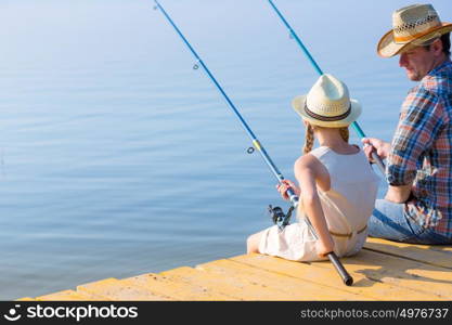 Father and daughter fishing. Father and daughter fishing on the pier