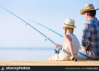 Father and daughter fishing. Father and daughter fishing on the pier